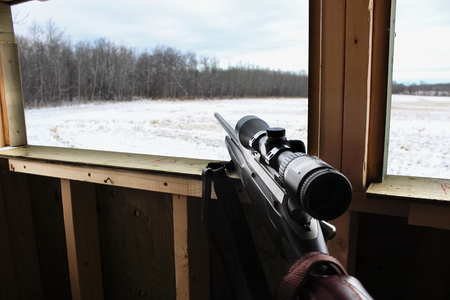 Hunter waiting in deer blind